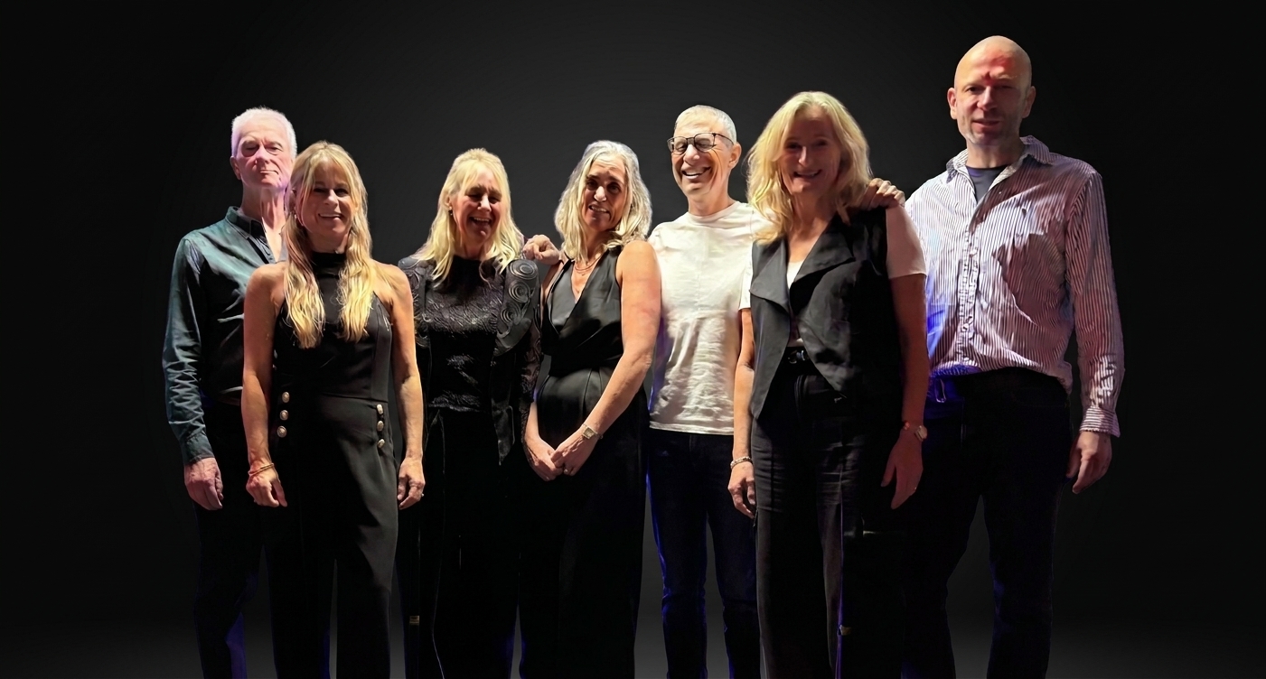 HG33 posing together on stage before a show